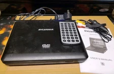 SYLVANIA PORTABLE DVD PLAYER, W/ REMOTE, WIRES, TESTED & WORKS