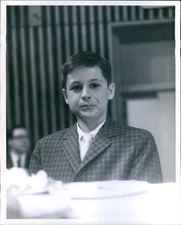 News Photo Proud Youngster Enjoys Post-Ceremony Cake & Ice Cream Event 8X10