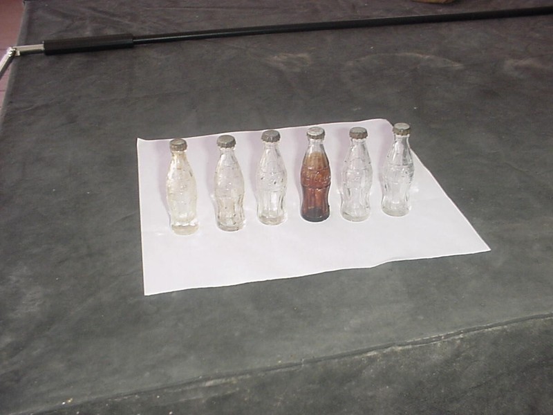 6 ORIGINAL MINI EMBOSSED COCA COLA/TRADEMARK REGISTERED- AROUND CENTER OF BOTTLE