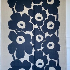 Marimekko ‘Unikko’ classic fabric in 100% linen. Navy blue on natural.