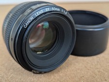 Canon EF 50mm f/1.4 Lens with hood. No haze/fungus. Very sharp.