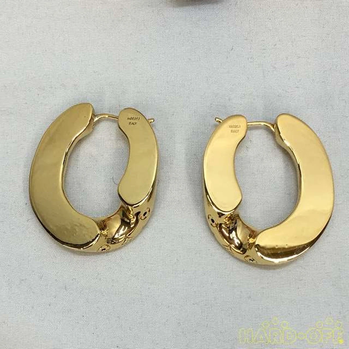 Louis Vuitton, A pair of Nanogram hoop earrings. Marked Louis