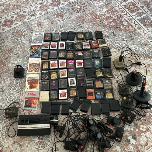 Atari 2600 console w/ 61 classic games, 16 Controllers, 5 Instructions Lot