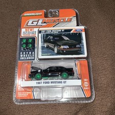 Greenlight CHASE GL Muscle Black 1987 FORD MUSTANG GT w/Extra Wheels  1:64