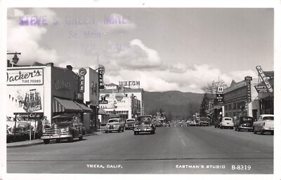 RPPC Street Scene Yreka California c1950 Cafe, Gas Station, Hotel, Grocery Store