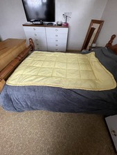 VINTAGE SINGLE QUILTED EIDERDOWN THROW IN A YELLOW COLOUR