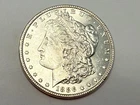 1886 Morgan U.S. silver dollar. Near gem BU, thick white luster. #em3
