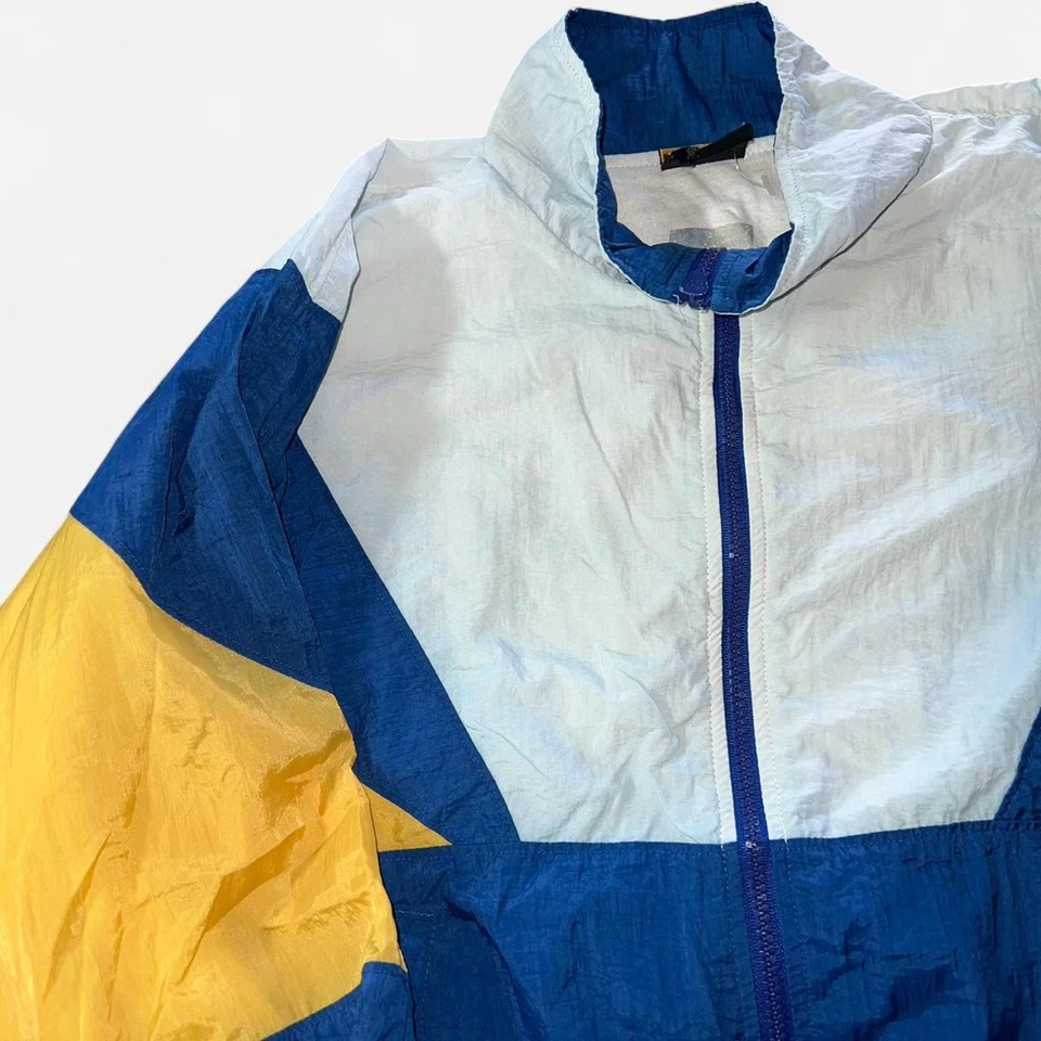 Chaqueta cortavientos juvenil L Puma azul y amarillo Foto 3 de 4