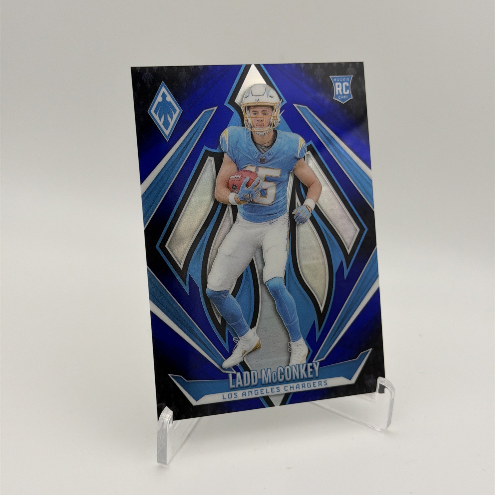 2024 Panini Phoenix - Rookies Ladd McConkey #216 Blue Fade /249 (RC)