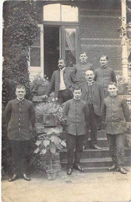 Location unknown, postcard men group of men in front of the house photo field post 1915