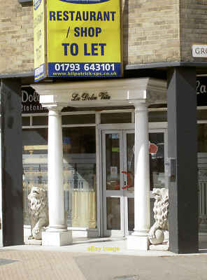 Photo 12x8 Someone please buy us Swindon Two lions with concerns on their  c2014
