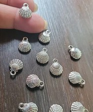 12 x Tibetan Silver Sea Shell Charms.