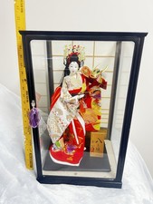 japanese dolls in glass case