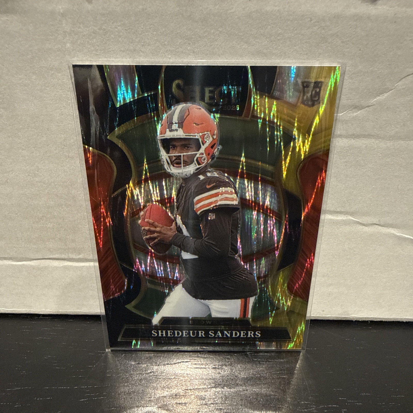 SHEDEUR SANDERS 2025 SELECT BLACK GOLD SHOCK CONCOURSE ROOKIE #54 BROWNS Q7060