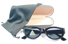 Ladies Oval Cat Eye Sunglasses With Glossy Black Frame And Black Lenses.