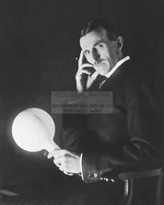 NIKOLA TESLA HOLDING TESLA POWERED LAMP INVENTER, ENGINEER, FUTURIST 8X10 PHOTO