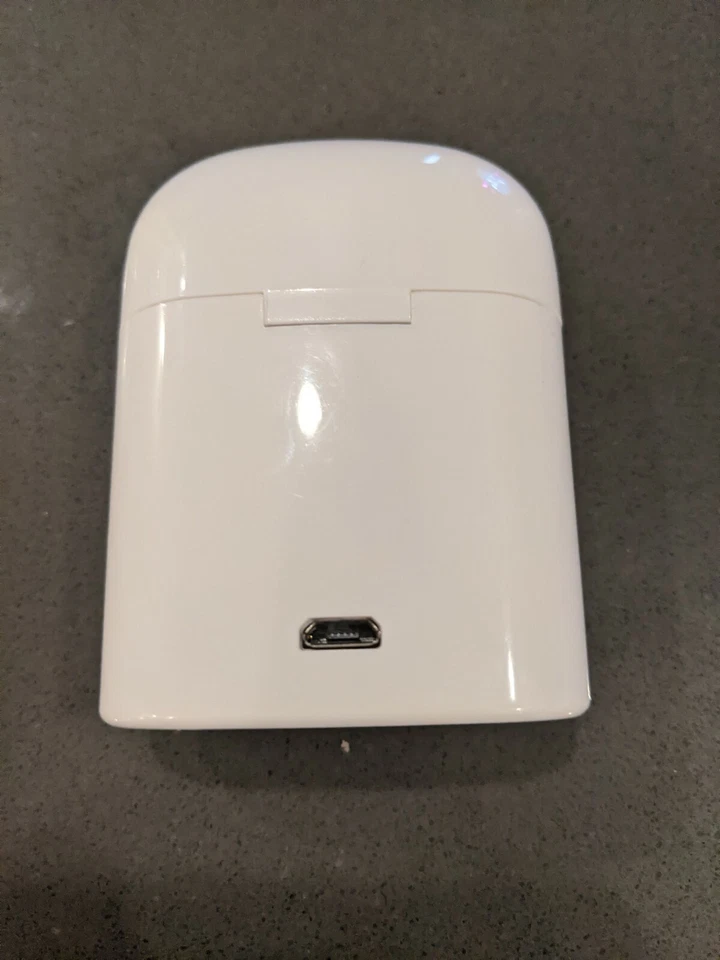 Auriculares inalámbricos dorados con estación de carga Foto 2 de 4