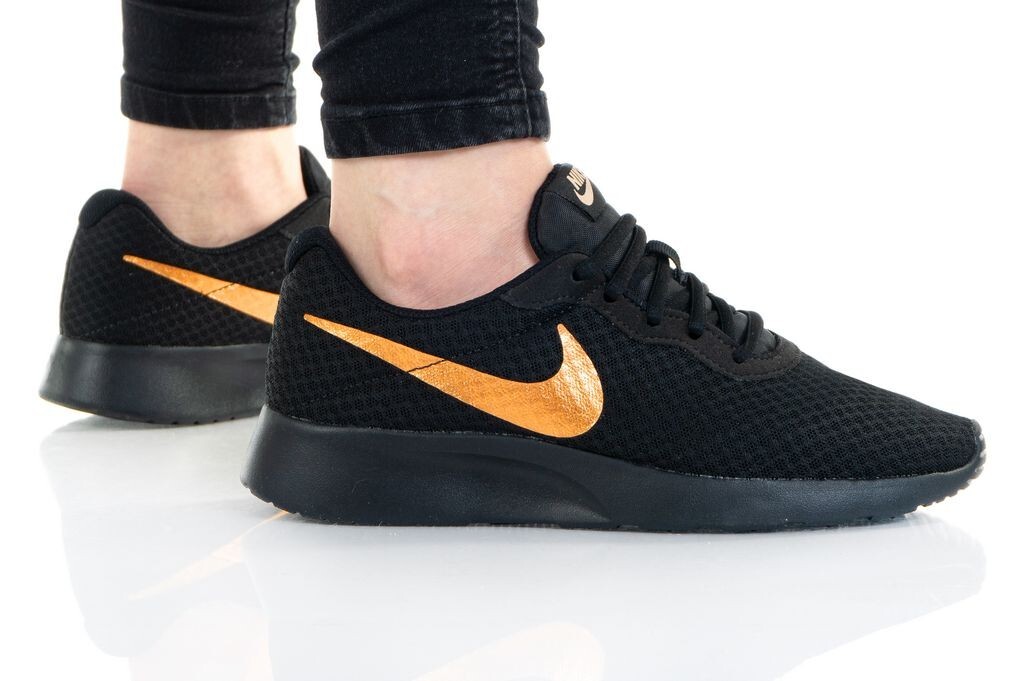 nike tanjun womens black and gold