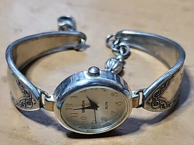 Geneva Elite Watch White Oval Shaped Face Silver Toned Etched Cuff Band