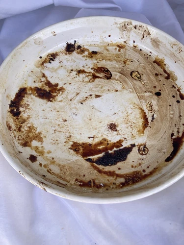 Oddity Extremely Rare Face like image appears on pan  Looks Like Family Member!