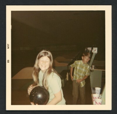 Grinning Teen Tween Girl Holding Bowling Ball Boy Looks On Vintage Photo 1960s