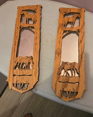 set of two hand-carved wooden mirrors with horses