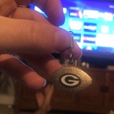 Green Bay Packers football-shaped charm keychain