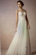 Tulle and Lace Wedding Gown.Size 16 sample never worn. Ivory with nude underlay.