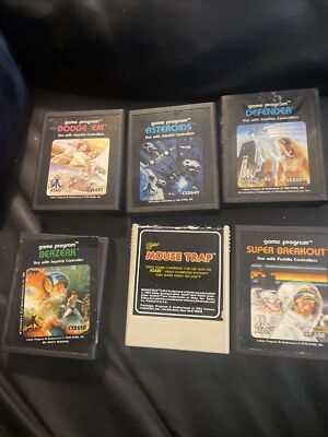 Collection of 6 Atari game cartridges. CX series. Dodge him, asteroids, defender