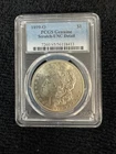 1899-O Morgan silver dollar. PCGS genuine, scratched(?)