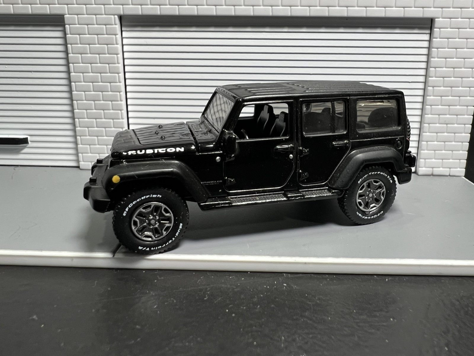 Auto World Jeep Wrangler Rubicon Black 1/64. LOOSE