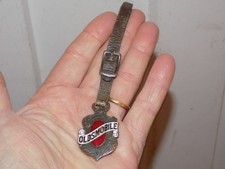 Vintage Oldsmobile Embossed Enamel Watch Fob With Leather Strap