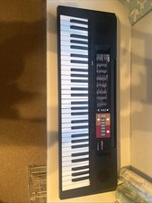 Yamaha Electronic Keyboard With Stand and charger. 