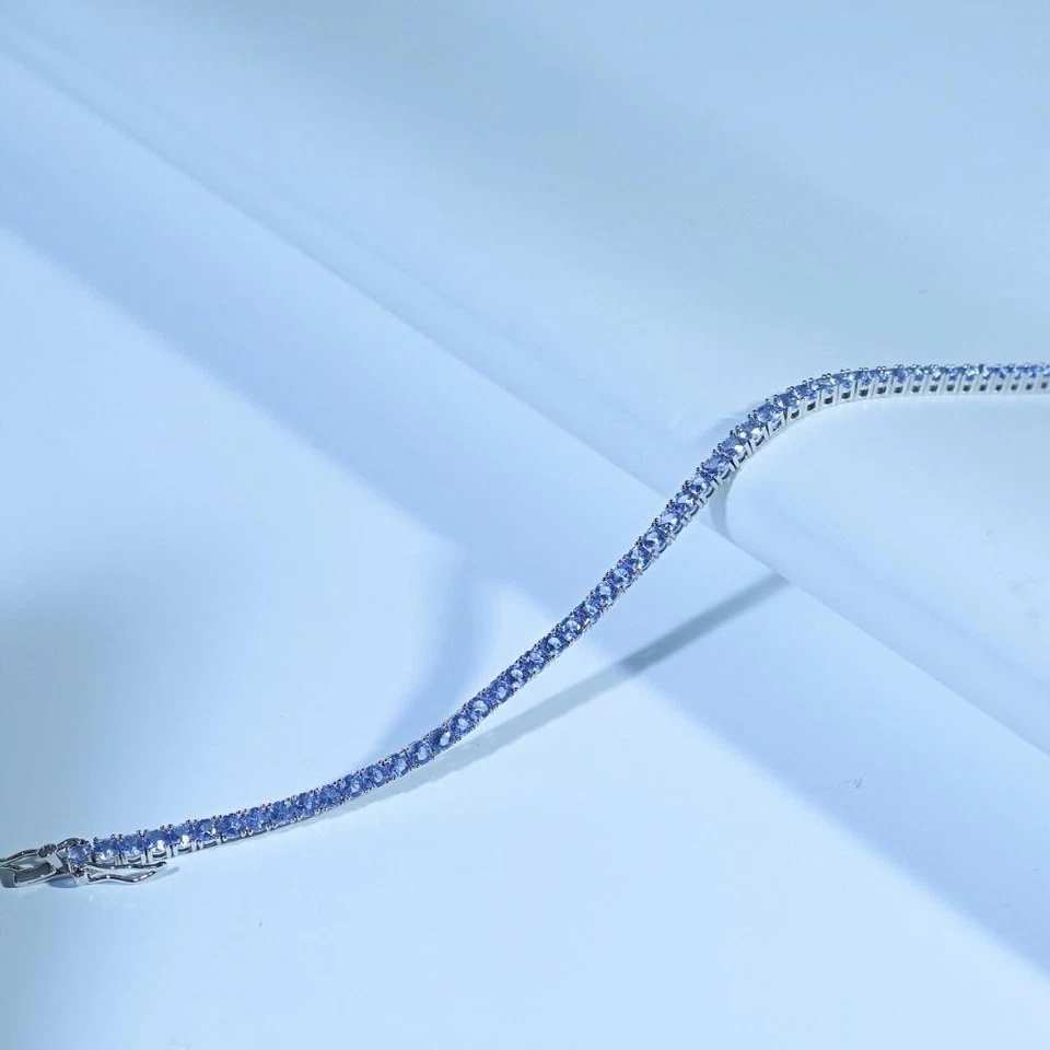 Brazalete de tenis de corte redondo de tanzanita enchapado en oro blanco de 14K de plata de ley 925 Foto 3 de 4