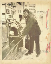 Press Photo Kathryn Lynch getting into her Mobile Attorney car in Anchorage, AK