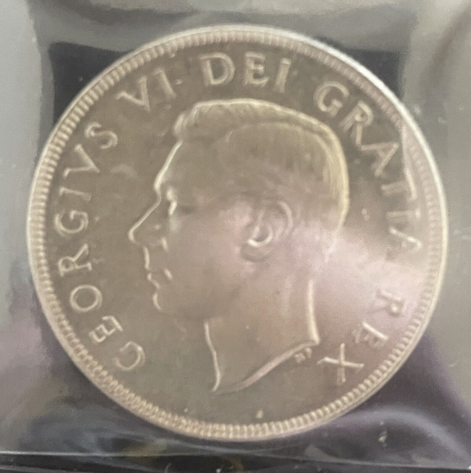 1951 George The Sixth Canadian Silver Dollar in prestige condition Au55