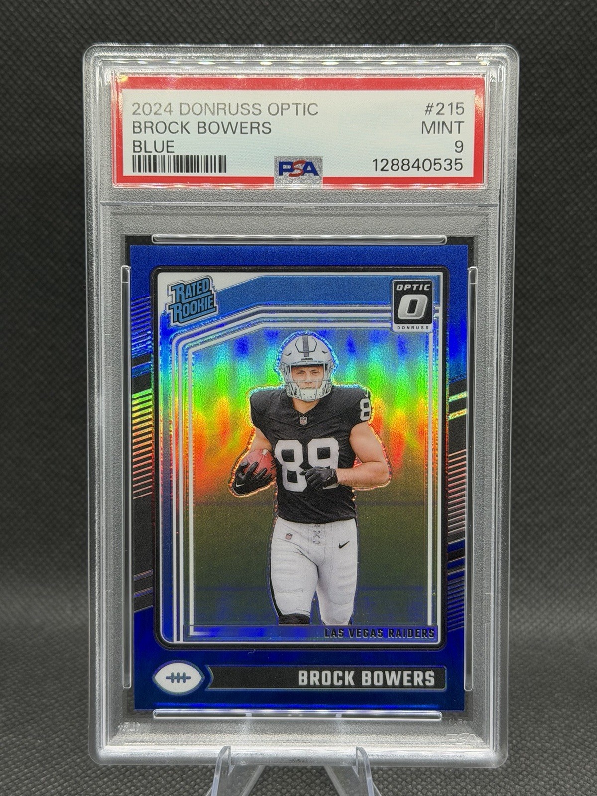 2024 Panini Donruss Optic - Rated Rookie Brock Bowers #215 Blue Prizm /199 (RC)