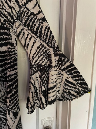 Womens black and white print top with ruffled sleeve. Sizes small through 3X. - Picture 4 of 6