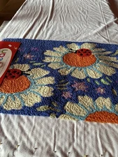 Jellybean Machine WashableAccent Rug Lady bug on daisies Blue background NWT