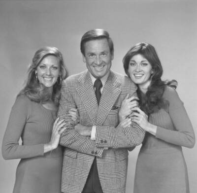American game show host Bob Barker poses flanked by two of the so-- Old Photo 1