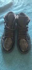 The Air Jordan 1 Mid Patent SE Triple Black 