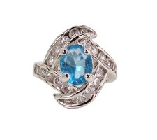 Blue oval cubic zirconia stone ring with clear round stones swirl design Size 7