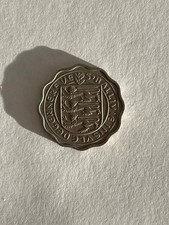A 1956 Guernsey Three Pence Coin in a good condition