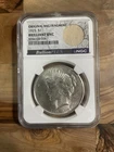 1925 Peace Silver Dollar $1 Graded NGC BRILLIANT UNC - Original Bag Fragment