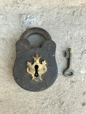 AN OLD SOLID IRON BRASS FISH SHAPE PEG PADLOCK WITH KEY .
