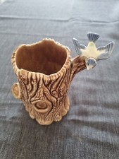 Wade Bird On Tree Stump - brown tree stump, blue bird