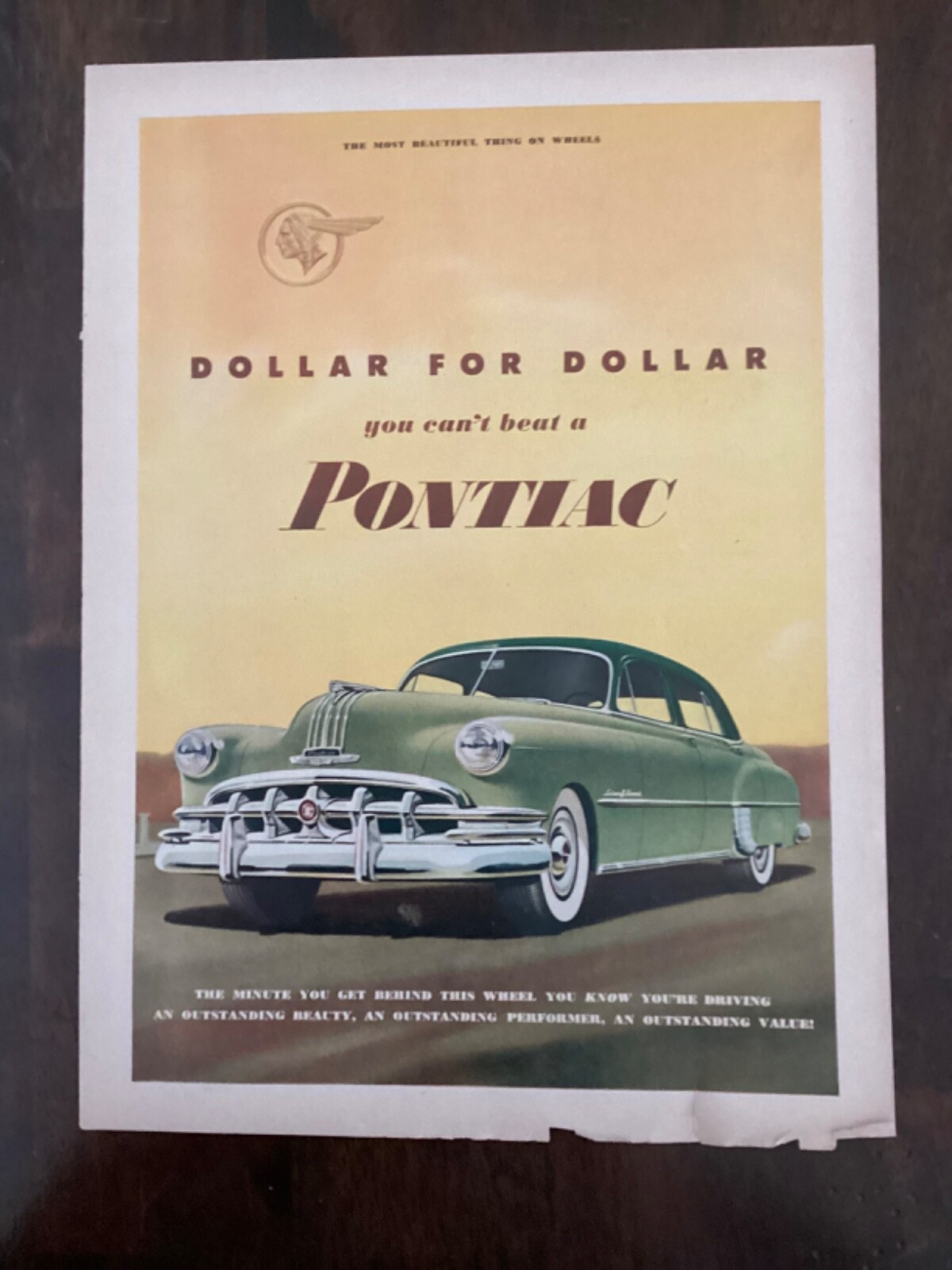 1949 Pontiac green four door sedan Ad