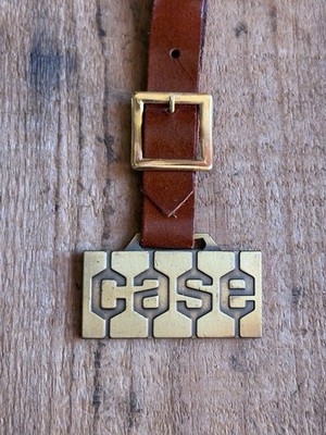 Vintage Brass Embossed CASE Equipment Advertising Watch Key Fob w/ Strap