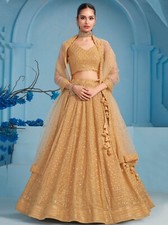Bollywood Style Beige Georgette Lehenga Choli With Net Dupatta For Reception
