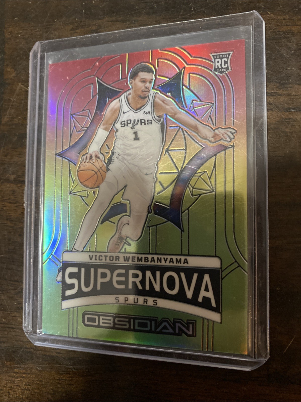 Victor Wembanyama 2023 Panini Obsidian Reggae Flood Supernova Prizm /60 Spurs RC